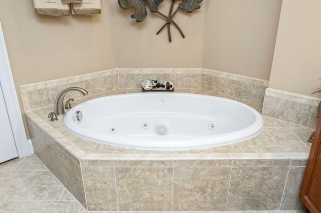 full bathroom featuring tile patterned floors and a tub with jets