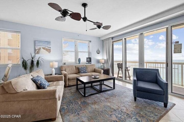 living room with light tile patterned floors and ceiling fan