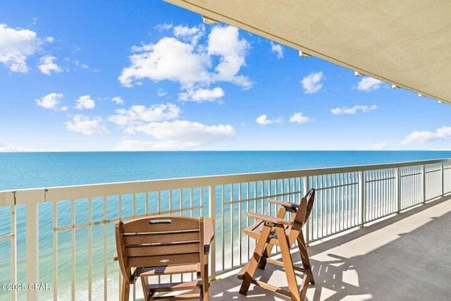 balcony featuring a water view