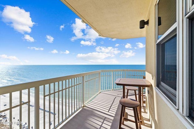 balcony featuring a water view