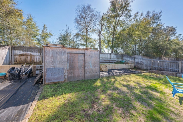 view of yard with a fenced backyard