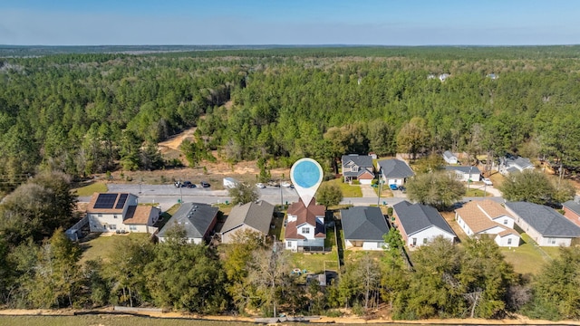 bird's eye view with a residential view and a view of trees