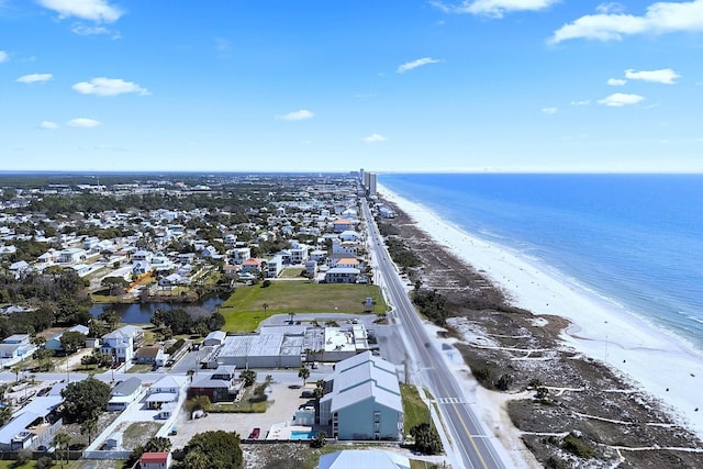 birds eye view of property featuring a view of the beach and a water view