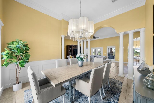 114 Golf Dr, Panama City Beach, FL 32408 - dining space with ornate columns, a chandelier, crown molding, plenty of natural light, and wainscoting