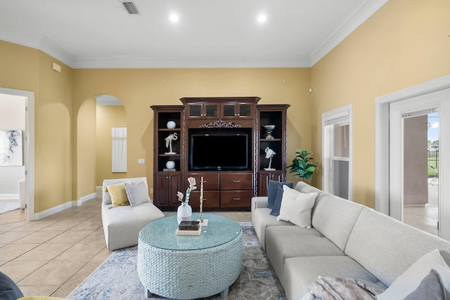 114 Golf Dr, Panama City Beach, FL 32408 - living area with arched walkways, crown molding, light tile patterned floors, and baseboards