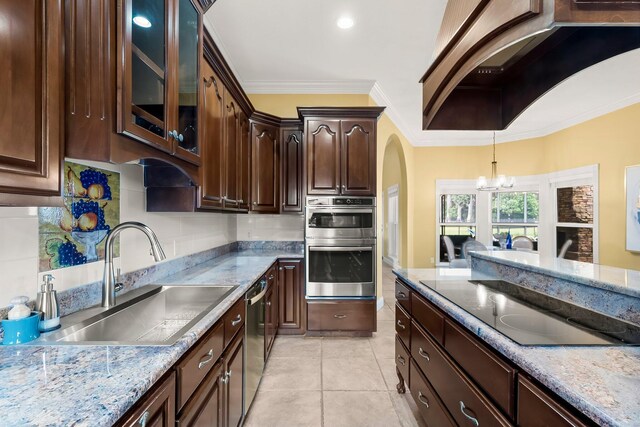 114 Golf Dr, Panama City Beach, FL 32408 - kitchen featuring a sink, stainless steel appliances, a chandelier, custom range hood, and tasteful backsplash