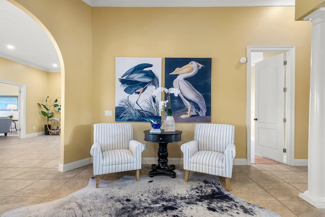 114 Golf Dr, Panama City Beach, FL 32408 - living area featuring arched walkways, tile patterned floors, baseboards, ornamental molding, and recessed lighting