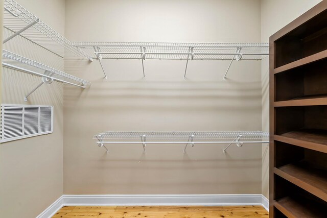 114 Golf Dr, Panama City Beach, FL 32408 - walk in closet featuring wood finished floors