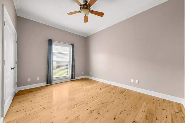 114 Golf Dr, Panama City Beach, FL 32408 - empty room with light wood-style flooring, baseboards, ornamental molding, and a ceiling fan