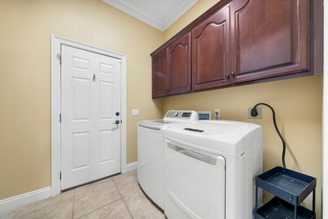 114 Golf Dr, Panama City Beach, FL 32408 - clothes washing area featuring ornamental molding, cabinet space, baseboards, washer and clothes dryer, and light tile patterned flooring