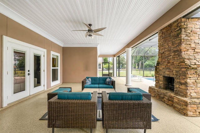 114 Golf Dr, Panama City Beach, FL 32408 - view of patio / terrace with an outdoor living space with a fireplace, a ceiling fan, french doors, and a lanai