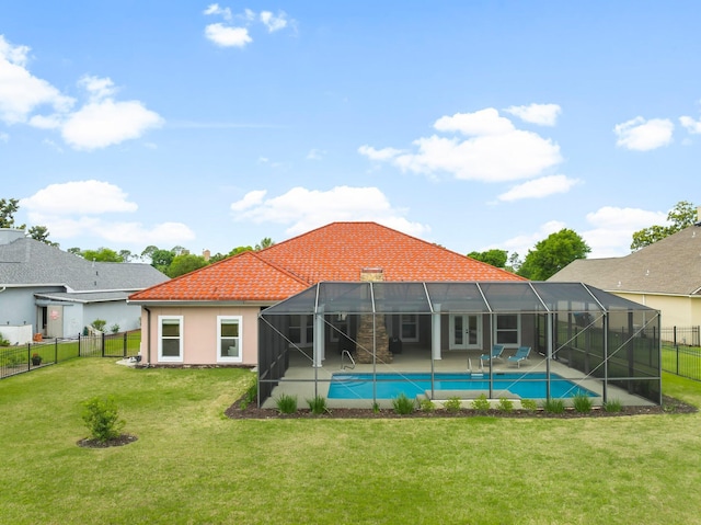 114 Golf Dr, Panama City Beach, FL 32408 - rear view of property featuring a patio area, a tile roof, glass enclosure, and stucco siding