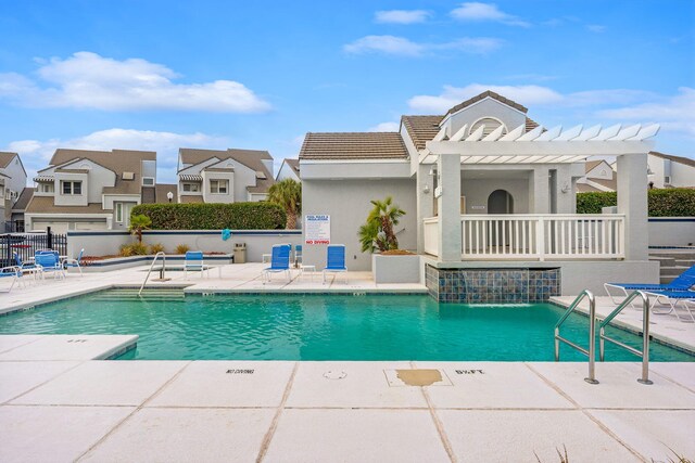 114 Golf Dr, Panama City Beach, FL 32408 - community pool featuring a pergola, fence, and a patio area