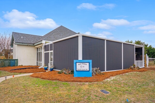 114 Golf Dr, Panama City Beach, FL 32408 - view of outdoor structure with a sunroom