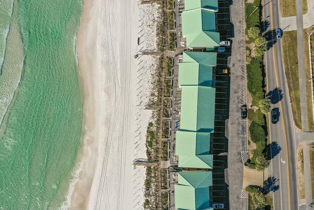 bird's eye view featuring a view of the beach and a water view