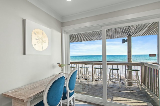 balcony featuring a water view and a view of the beach