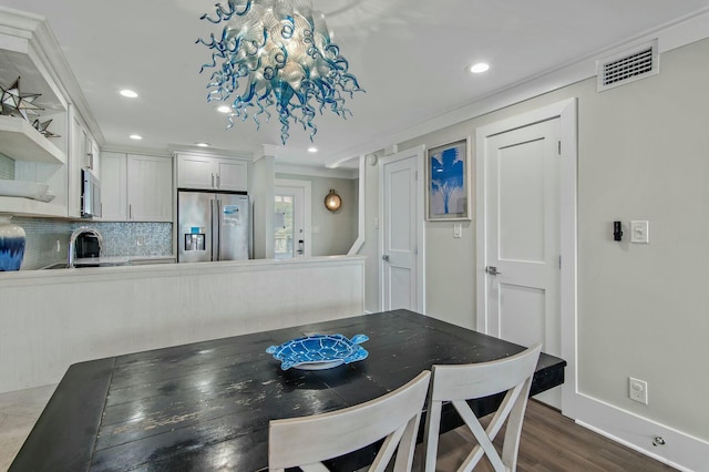 dining area featuring recessed lighting, visible vents, baseboards, and dark wood finished floors