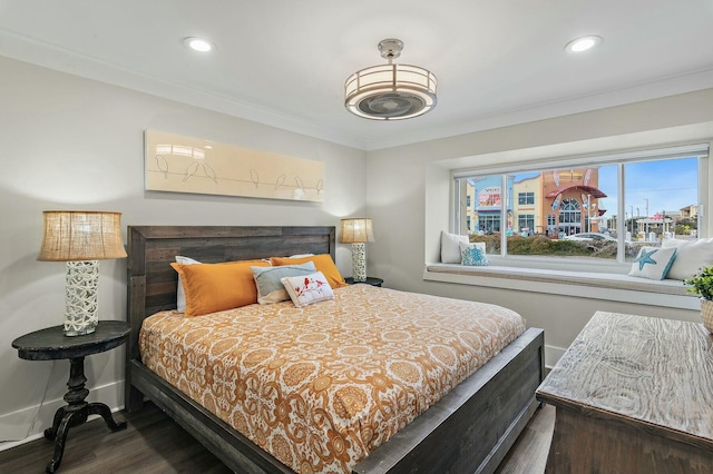 bedroom with recessed lighting, ornamental molding, baseboards, and wood finished floors