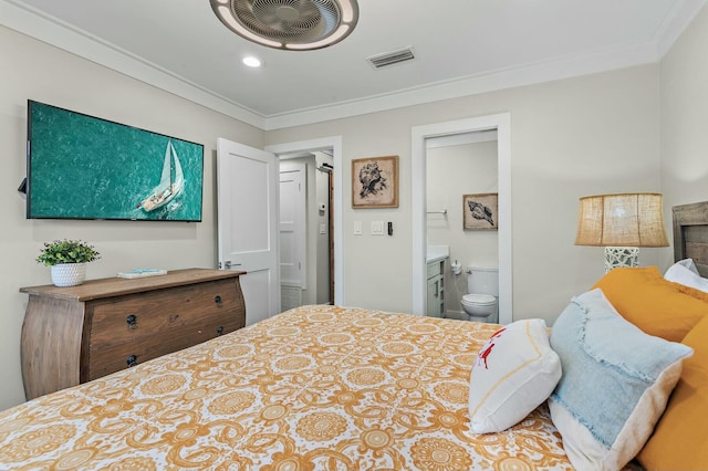 bedroom with visible vents, connected bathroom, and crown molding