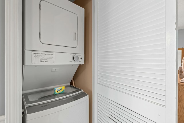 washroom with laundry area and stacked washer and dryer