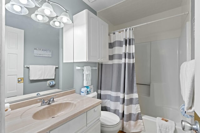 full bathroom with shower / bathtub combination with curtain, toilet, and vanity