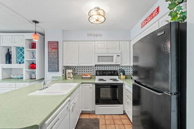 kitchen featuring a sink, white appliances, white cabinets, and light countertops