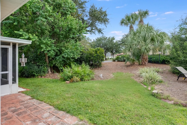 view of yard featuring a patio and fence