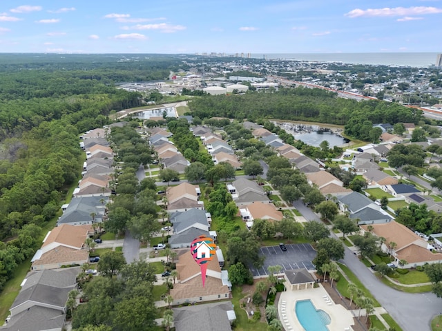 birds eye view of property with a residential view and a water view