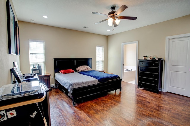 bedroom with visible vents, wood finished floors, recessed lighting, connected bathroom, and ceiling fan