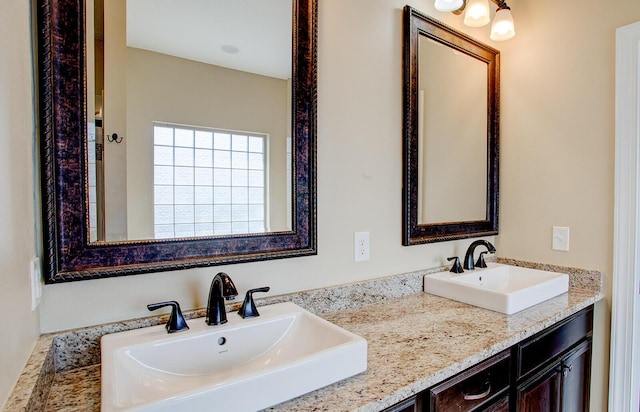bathroom with double vanity and a sink