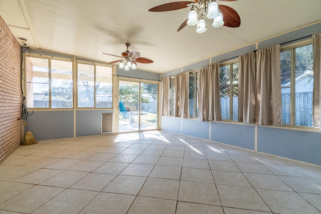 unfurnished sunroom featuring ceiling fan