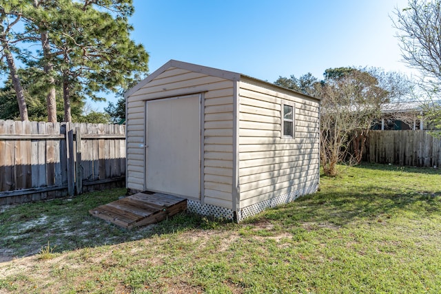 view of shed featuring a fenced backyard