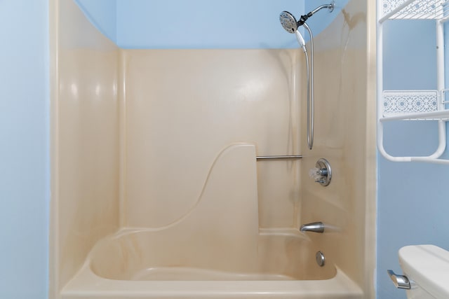 full bath featuring toilet and  shower combination