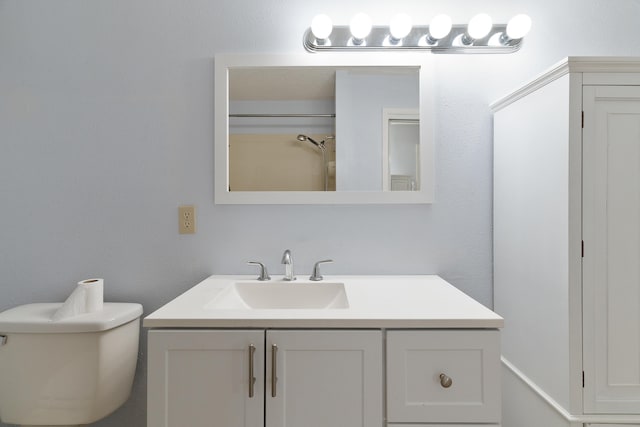 bathroom with toilet and vanity