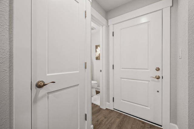 corridor with dark wood-type flooring