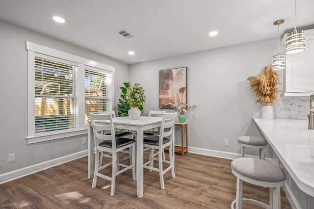 dining area with recessed lighting, visible vents, baseboards, and wood finished floors