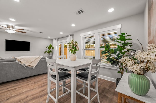 dining space with visible vents, recessed lighting, baseboards, and wood finished floors