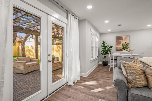 doorway featuring visible vents, wood finished floors, recessed lighting, french doors, and baseboards