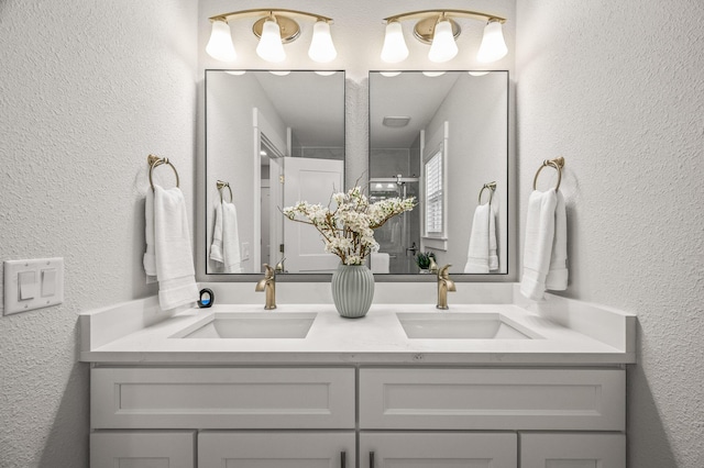 full bathroom with a textured wall and a sink