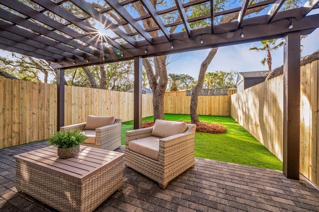 view of patio with an outdoor living space, a pergola, and a fenced backyard