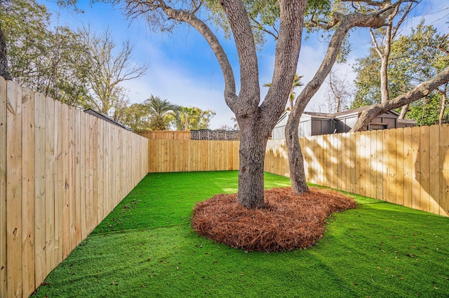 view of yard with a fenced backyard