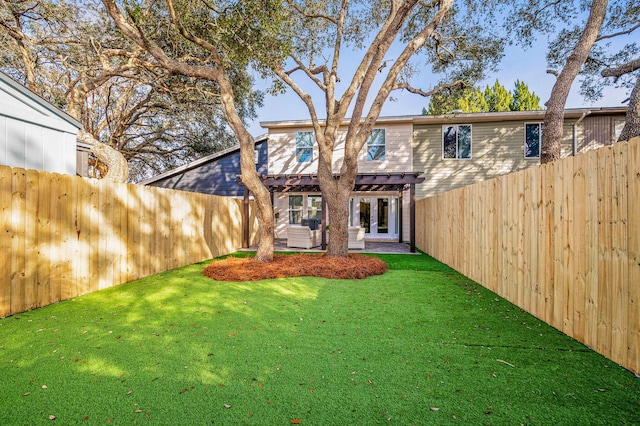 rear view of property with a patio area, a lawn, and a fenced backyard