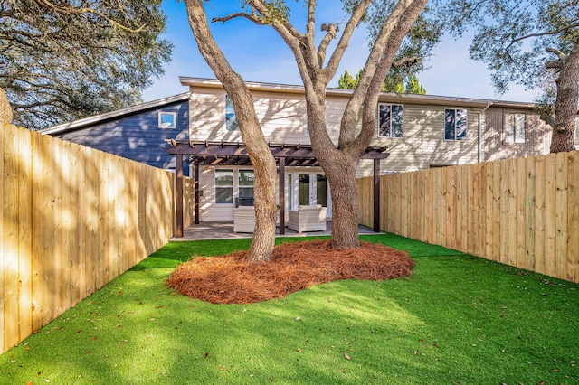 back of house with a patio area, a lawn, a fenced backyard, and a pergola