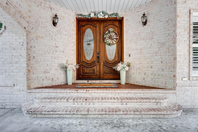 property entrance with brick siding