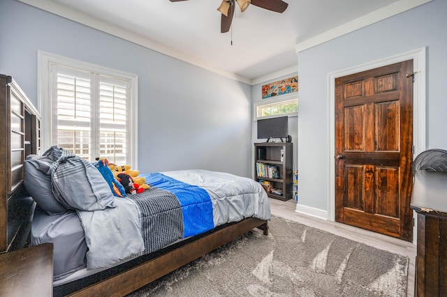 bedroom with ceiling fan and wood finished floors