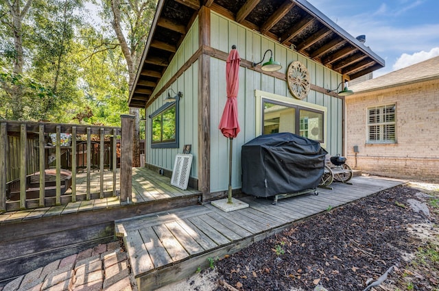 wooden deck featuring grilling area