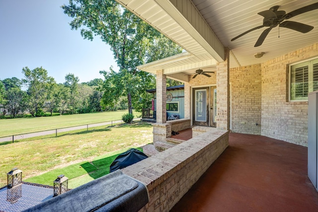 view of patio / terrace featuring fence and ceiling fan