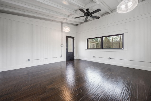 unfurnished room with beamed ceiling, dark wood-style floors, baseboards, and ceiling fan