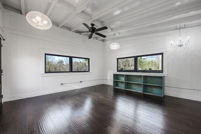 unfurnished room featuring baseboards, coffered ceiling, ceiling fan with notable chandelier, and hardwood / wood-style flooring