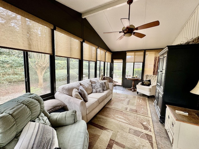 sunroom with vaulted ceiling with beams and a ceiling fan